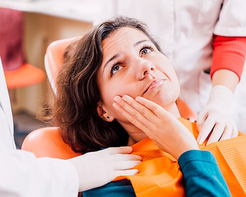 Woman at the dentist with a toothache