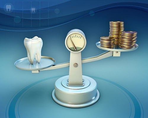 Tooth and coins on a balance scale