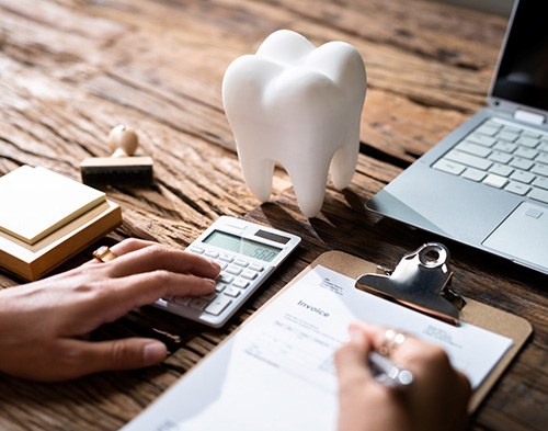 Top of blank dental insurance form with glasses, x-ray, and pen