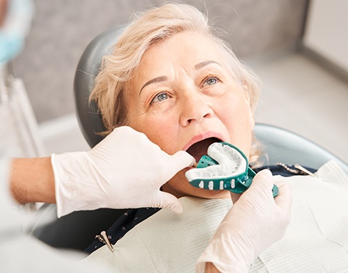 The creation of your new dentures begins in your dentist’s office in Jenks, OK