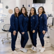 Four smiling dental team members at Elwood Avenue Dental