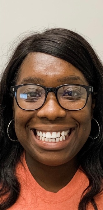Woman with slightly gapped teeth smiling before treatment from Jenks dentist